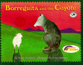 The book jacket shows a drooling gray coyote and a white little lamb in a meadow at the base of a mountain.