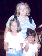 This is a photograph of Donna Gomes and her two daughters.