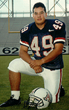 This is a photograph of T. J. Rodriquez, Jr. dressed a football uniform.