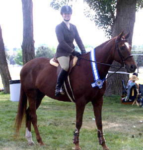 This is a photograph of Susie and her horse Junior at a horse show in Boise, ID