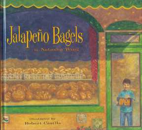 The cover of the book shows Pablo holding an open sign in the door of his parents' bakery.