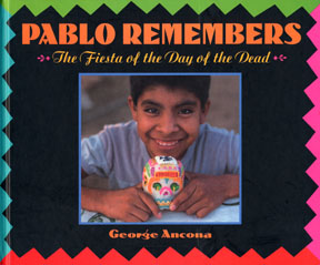The book jacket is a photograph of a Oaxacan boy holding a sugar skull.