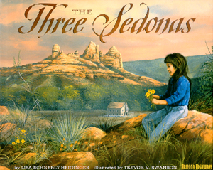 The book jacket shows a young girl playing with flowers with the towering red rocks in the background.  The sky is ablaze with colors.