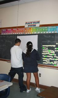 Two students make a graph representing their data.