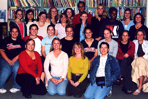 This is a photograph of the Fall 2003 LRC 480/580 class taken in the Children's Literature Library.