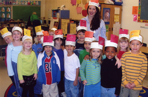 A kindergarten class wearing headbands with pictures of animals from the book I Howl, I Growl.