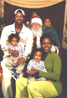 This is a photo of the Harris family sitting on Santa's lap